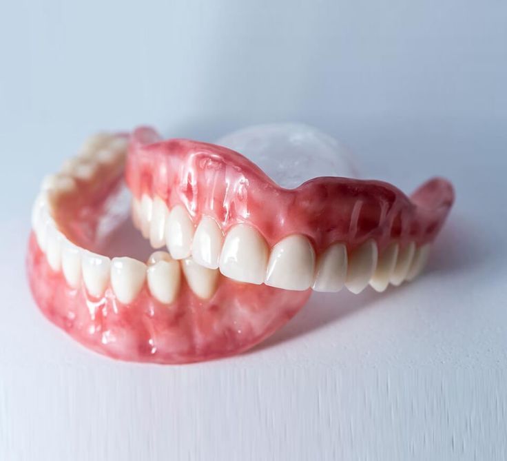 Full upper and lower acrylic dentures